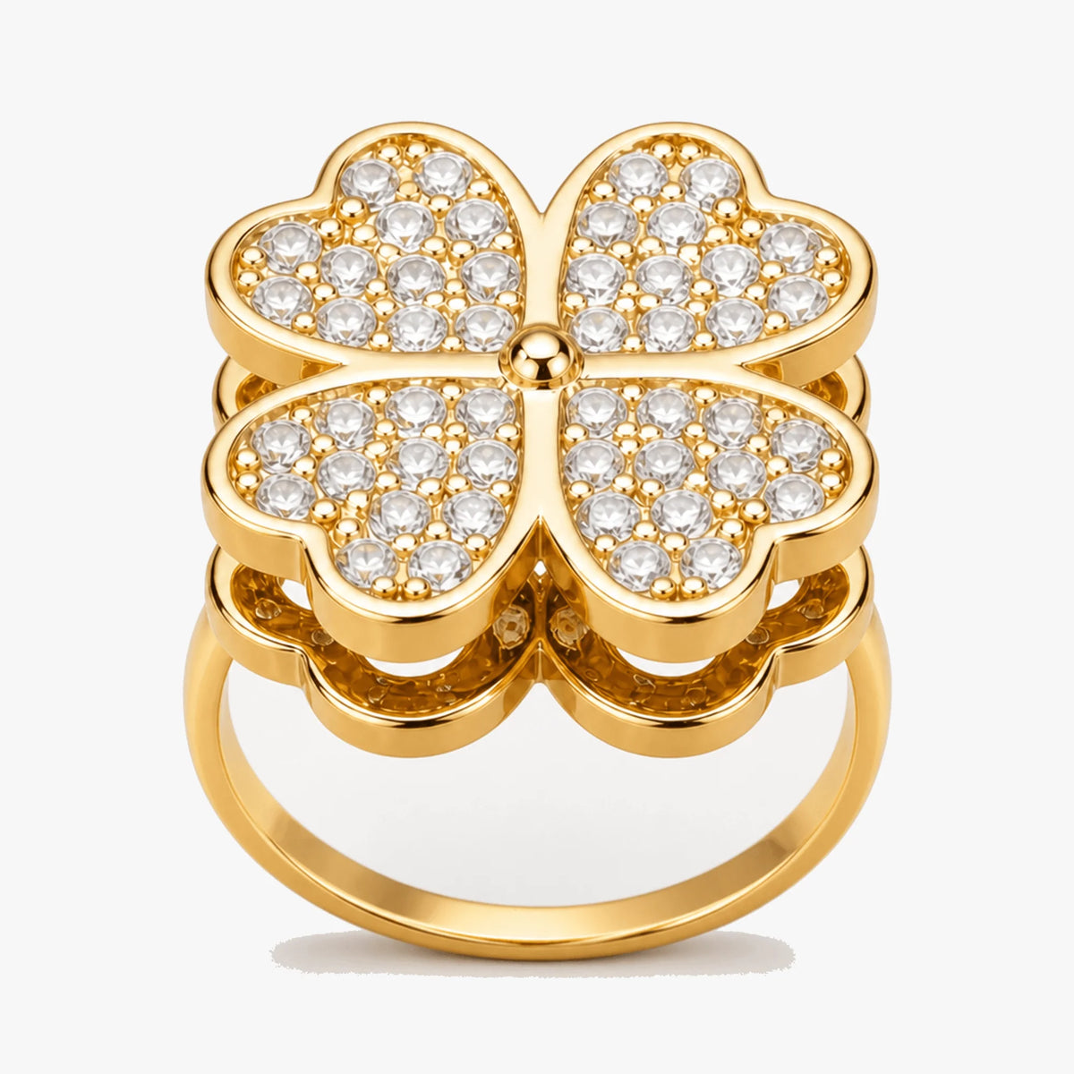 Justerbar fidgetring i guld med blomsterkløvermotiv og klare sten