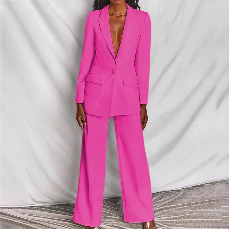 Gertrud blazer- og buksesæt i lys pink/fuchsia med reverskrave og vide buksben