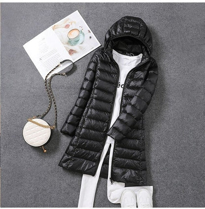 Iris | Long puffer jacket with hood and horizontal quilting