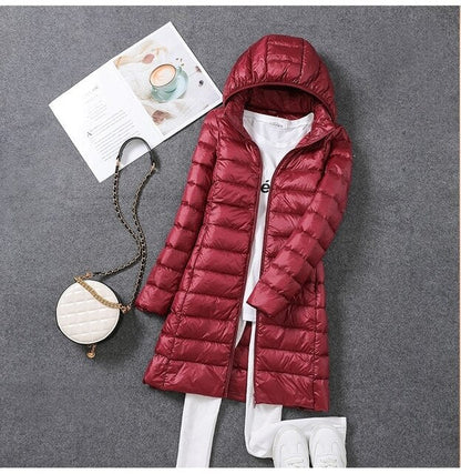 Iris | Long puffer jacket with hood and horizontal quilting