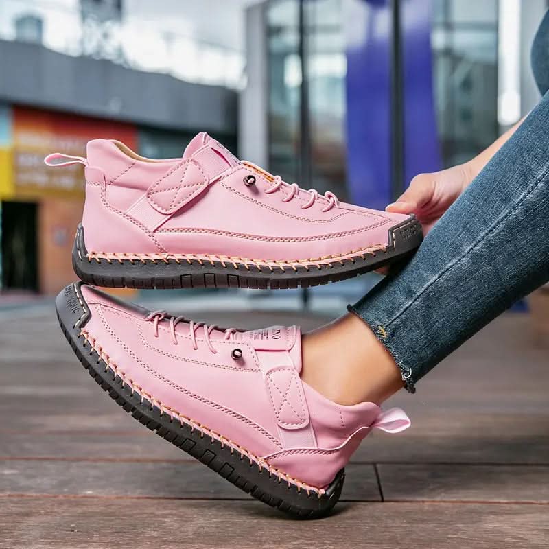 Lyserøde sneakers med snørebånd, elastikstrop og profileret mørk sål