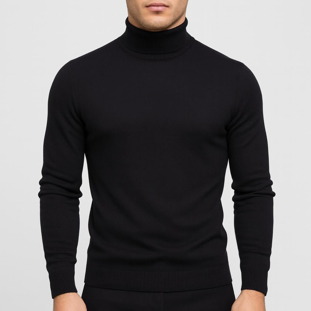 Sort strikbluse med rullekrave og ribstrikkede manchetter samt ribbet bundkant.