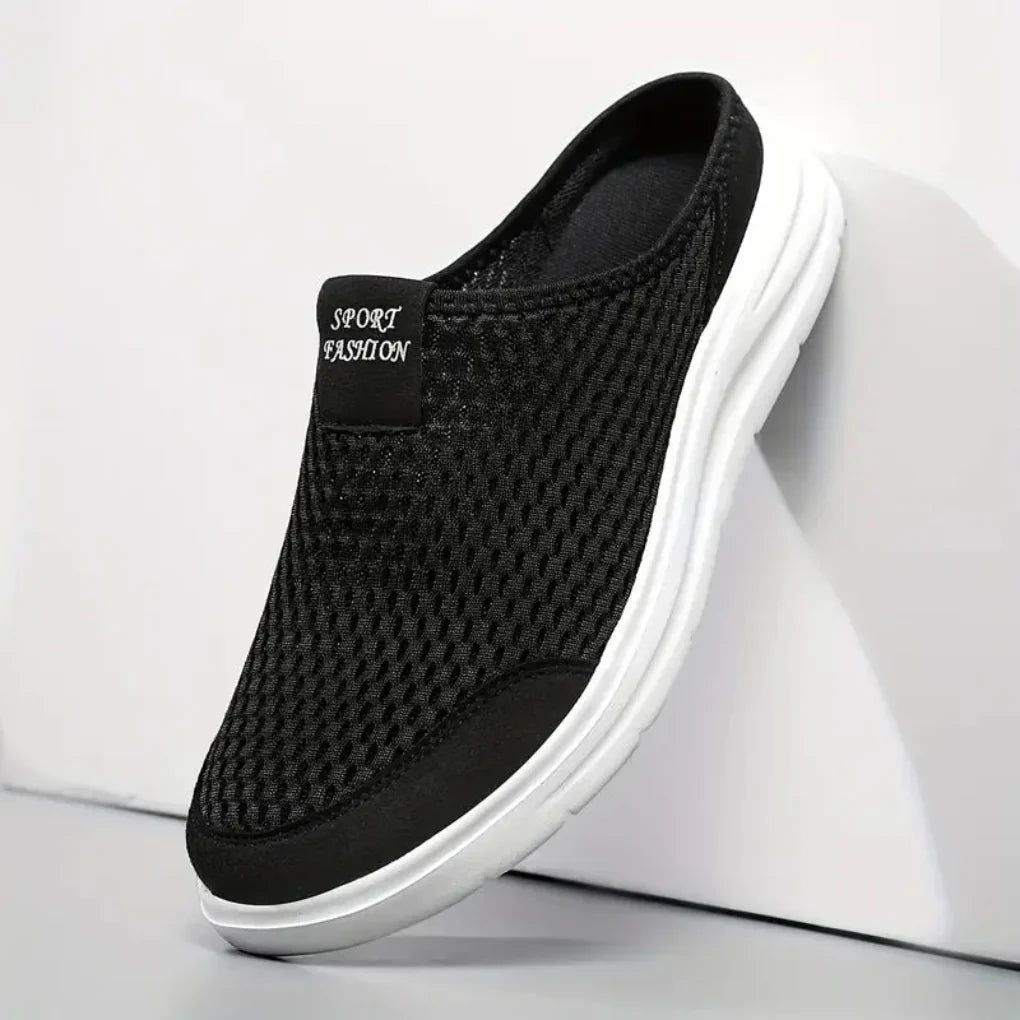 Sorte slip-on sneakers med åben hæl, meshoverdel og profileret hvid sål